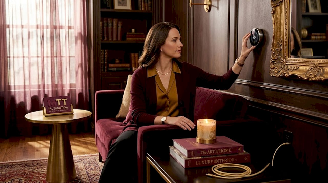 Woman adjusts smart thermostat in living room