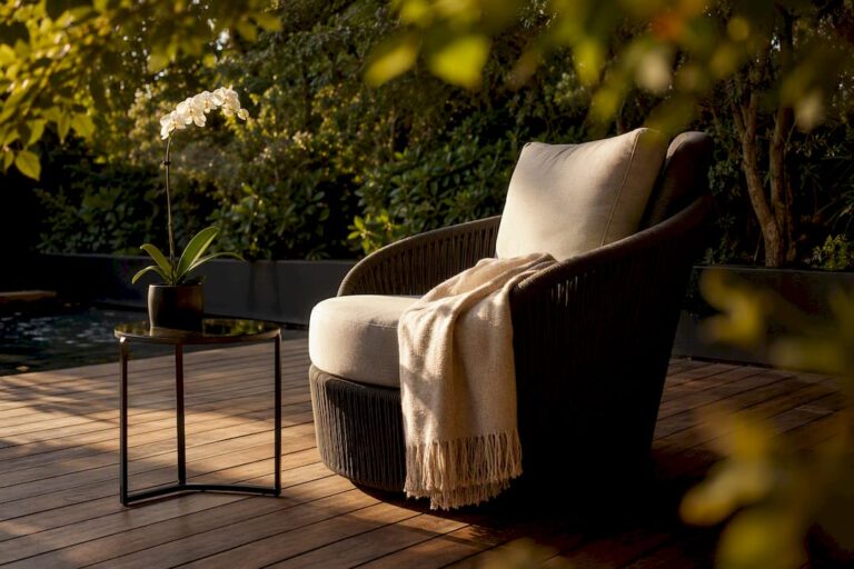 Close-up of luxury resin wicker outdoor lounge armrest and cushion